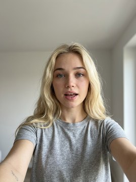 The same digital twin, holding the camera herself for a short-form cut